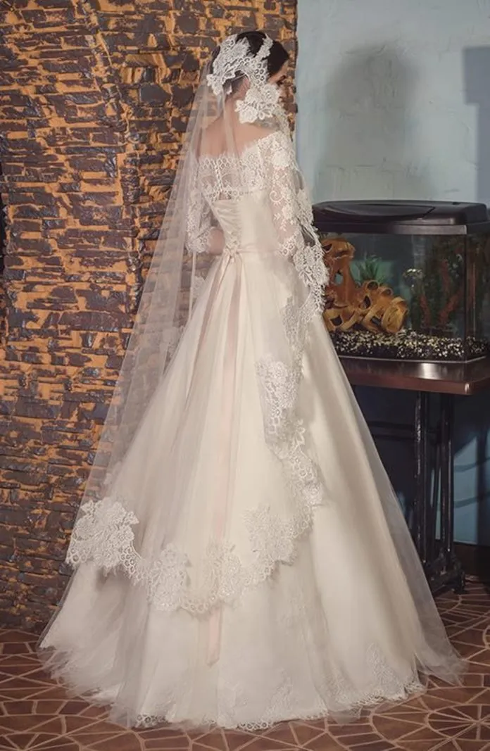 ---Romantic A-line wedding dress made of semi-sheer lace bodice with half sleeves, satin lining and long tulle skirt with lace a